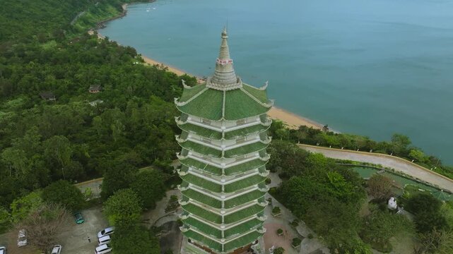 Aerial View of Thap Xa Loi Pagoda Tower in Da Nang, Vietnam
Vietnamese Buddhist architecture, green tiled roofs, and ornate carvings set against the lush mountains of the Son Tra Peninsula in Da Nang