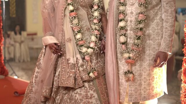 Stunning Indian Couple Adorned in Ornate Ethnic Wear at a Traditional Wedding