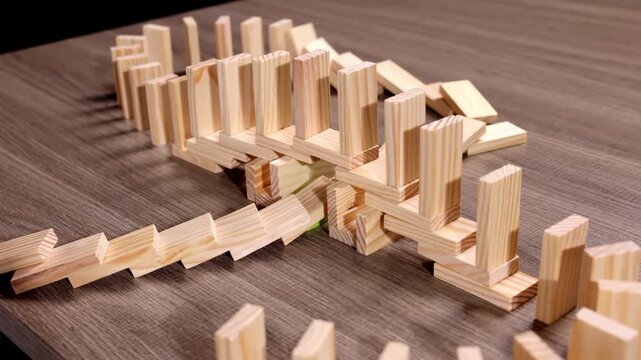 Green bars triggers domino effect, cause and reason connection, crisis idea economy business, metaphor for chain reaction, systemic change, the power of a single action, butterfly effect