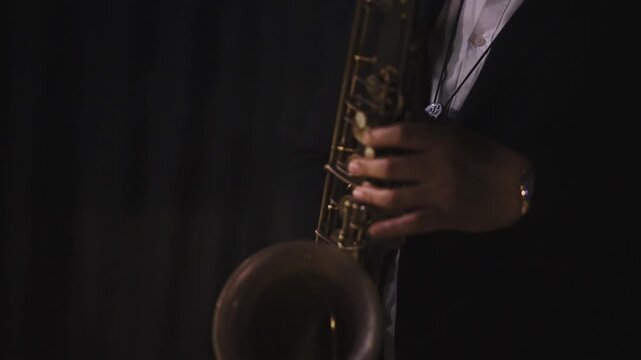 Cinematic Close-Up Professional Musician Playing Saxophone with minimalist black background - Jazz Performance Concept 