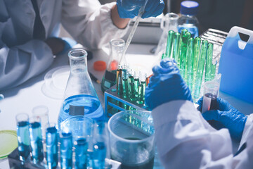 Fototapeta premium Science, laboratory and woman with pipette, test tube and biotech solution in research. Medical innovation, scientist or lab technician in study for healthcare, medicine and vaccine results feedback.