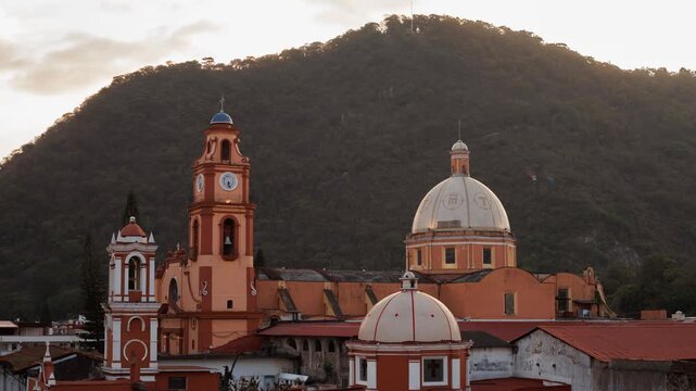 Sunset-to-night time-lapse of Ex Convento San Jose de Gracia with Cerro del Borrego behind, city lights emerging and cable car line visible in Orizaba, Veracruz, Mexico.