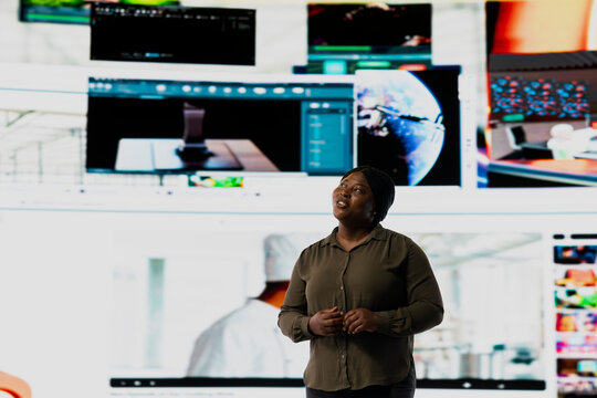 Joyous woman pleased by immersive technology interaction with video content. Happy viewer thrilled to browse through stream of social media updates representing hyperconnected culture concept