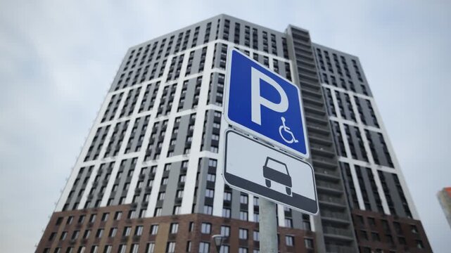 Informational symbol integrates into modern environment guiding drivers in city infrastructure. Visual contrast highlights accessibility