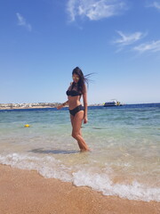 Fototapeta premium young woman on the beach