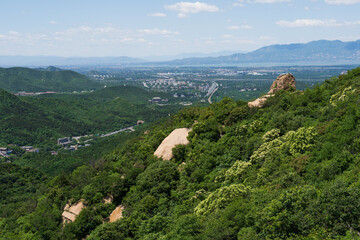 Fototapeta premium Mountain valley in the Yan Mountains overlooking countryside near Beijing
