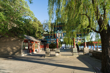 Traditional lakeside gate and willow trees at Beihai Park Beijing