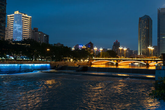 Twilight Skyline Reflections on the Jinjiang River Promenade in Chengdu