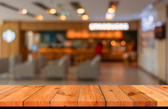 brown wooden board over blurred bokeh indoor