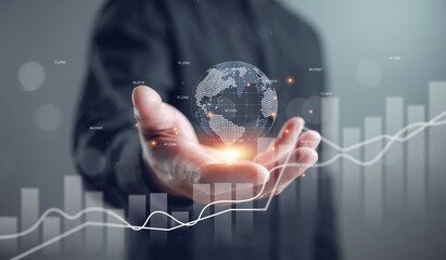 Business professional holding digital globe with financial graph overlay, symbolizing global investment, data analytics, fintech growth, and strategic market expansion in modern economy.