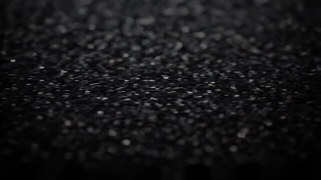 Close-up of Smooth Black Asphalt Surface with Fine Texture Under Low Light, Ideal for Urban Infrastructure or Roadway Design Visuals