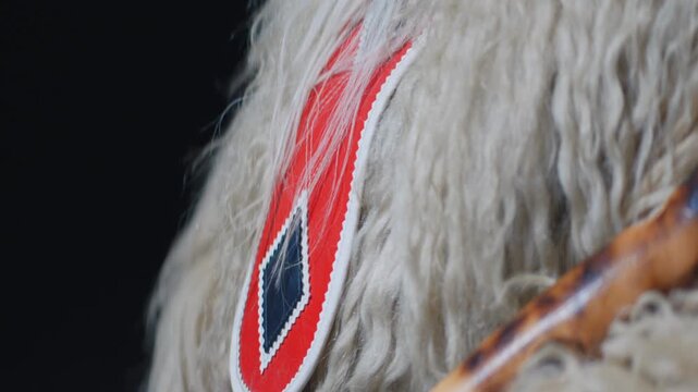 Close up of traditional Kurent costume detail during Pust carnival festival in Slovenia