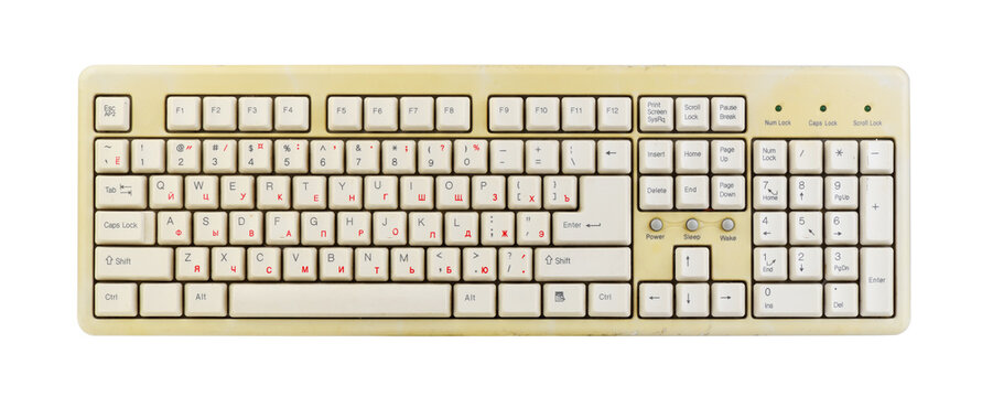 Vintage computer keyboard from the 1990s isolated on white background.