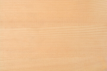 Fototapeta premium Full frame texture of a smooth light brown wooden surface with natural horizontal grain patterns and a small dark knot