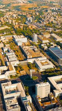 Vertical video. Rome, Italy. Piazza Guglielmo Marconi. District EUR - Quarter is a vast complex of buildings built on the orders of dictator Benito Mussolini. Drone footage, Point of interest. Rich c
