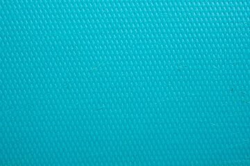 Turquoise blue textured surface with diamond embossed pattern and industrial plastic material