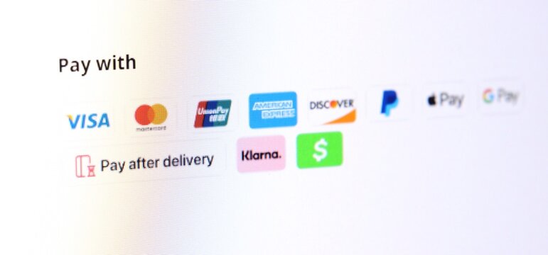 Various online payment options displayed on a website checkout screen. Digital e-commerce icons for financial transaction and money transfer. Internet shopping cart checkout interface concept.