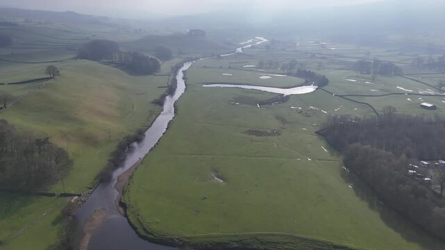 Aerial view over the River Ure in Hawes from a drone 4K video