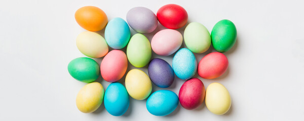Fototapeta premium holiday preparation Multi colors Easter eggs on colored background . Pastel color Easter eggs. holiday concept with copy space