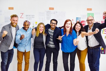 Obraz premium Diverse team celebrating success.