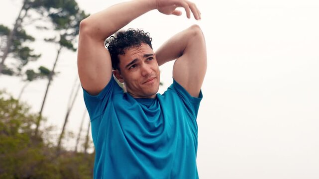 Man, stretching arms and fitness on mountain with breathing, flexibility or wellness in morning. Person, runner and warm up for triceps with circulation, muscle and prepare for exercise in nature