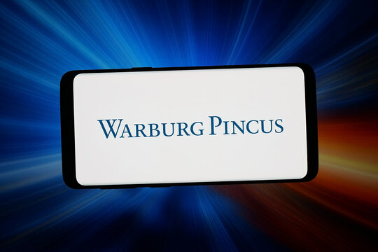 Stuttgart, Germany - 03-06-2026: In this photo illustration, the logo of US private equity company Warburg Pincus LLC is displayed on a smartphone in front of abstract background on computer screen.