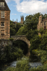 Water of Leith Flowing Beneath a Stone Bridge in Dean Village - Edinburgh, Scotland