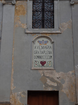 Ave Maria gratia plena Dominus Tecum mosaic on an old building in Monticelli d'Ongina, Emilia Romagna, Italy