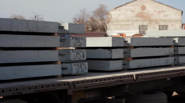 Stacked precast concrete slabs loaded on construction truck