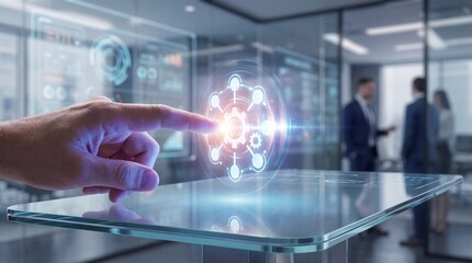 Fototapeta premium A hand activating a glowing innovation strategy icon above a transparent table in a modern office environment with blurred professionals in the