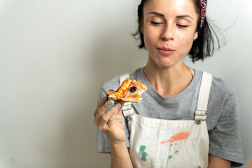 Woman enjoying delicious pizza slice