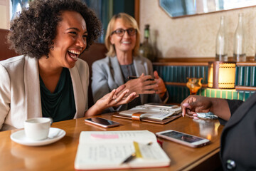 Joyful meeting in cozy cafe.