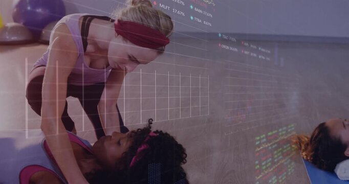 Fitness coach checking client head alignment adjusting with towel as charts overlaying subjects