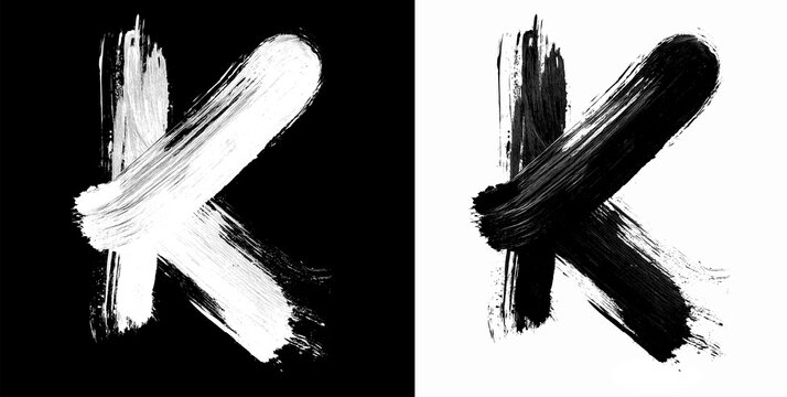 Brushstroke letter K in bold grunge style on split isolated black and white background, symbolizing contrast and creativity
