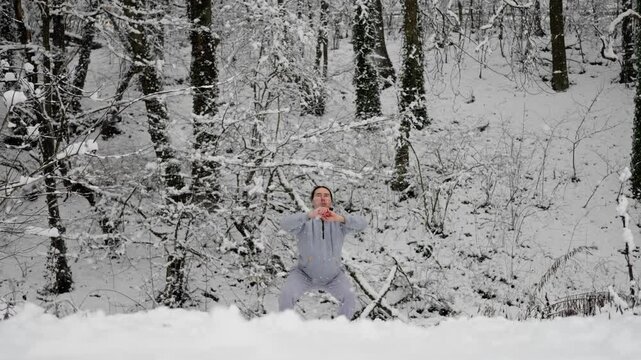 Calm Man Trains Amid Snow. Peaceful Person Transitions From Meditation To Active Training In Winter Forest. Tranquil Man Shifts From Quiet Meditation To Dynamic Exercises In Snowy Woodland Environment