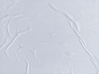Obraz premium White crumpled and creased paper poster texture background. Abstract blank white paper surface background. Soft creased crumpled paper poster texture.
