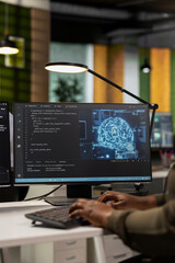Close up of startup company employee testing AI machine learning algorithms at work. Software...