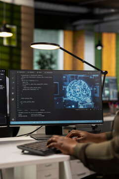Close up of startup company employee testing AI machine learning algorithms at work. Software developer scaling productivity with artificial intelligence large language model technology