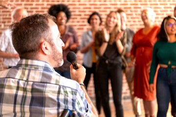 Speaker engaging diverse audience.
