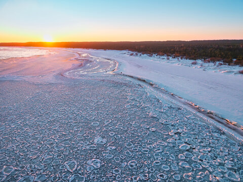 Ice toros on the Baltic Sea beach in Mikoszewo at sunrise. Poland