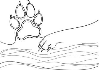 A hand reaching out to touch a large animal paw print