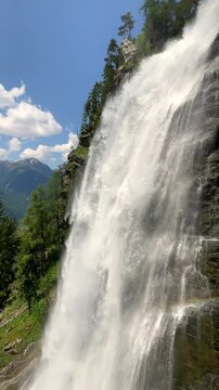 Stuibenfall waterfall bigest waterfall in Tirol in the Otztal valley in Tyrol Austria during a beautiful springtime day in the Alps. Vertical video.