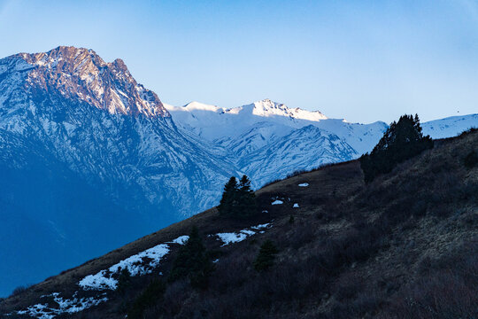 Sunset in the grassland of Nepal with snowy. mountains in the background | Yaltingey Danda in Dolpa, Nepal