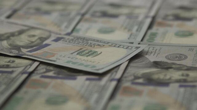 Overlapping Hundred Dollar Bills Close Up