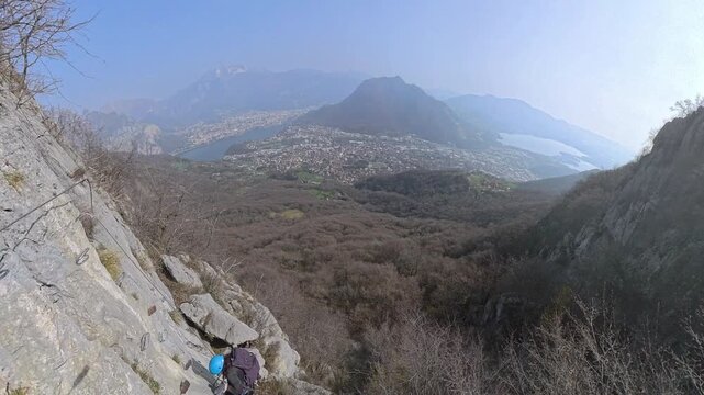 Via Ferrata Corno Rat, Valmadrera, Lecco, Lombardia - 22 climbers ascend the via ferrata on vertical walls with sweeping views of the city