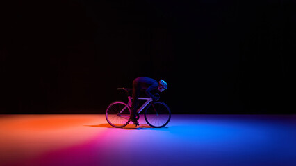 Naklejka premium Road cyclist in aerodynamic position on dark background with copy space. Concept of speed optimization, sports technology, insurance protection, fintech performance and modern brand communication.