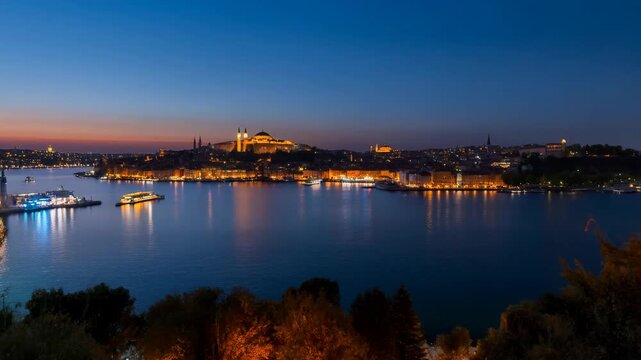 Istanbul skyline at dusk with illuminated mosques and ferries on the Bosphorus