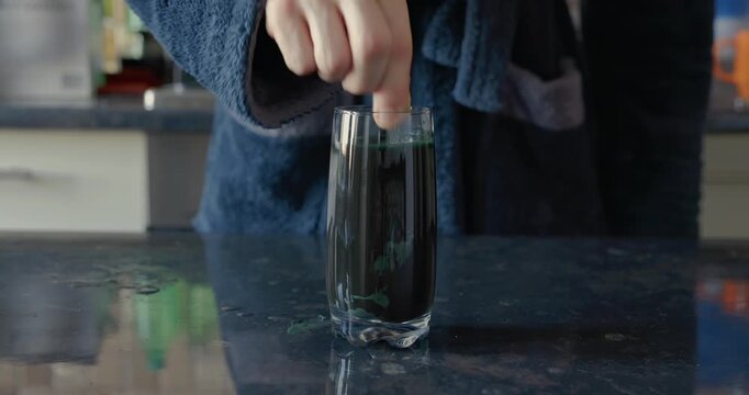 Mixing a spirulina beverage in the glass, audio included