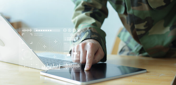 soldier man hand click on tablet to use program of radar and radio aviation for test system of tracking and defense at the dark control room center in monitor station for military technology concept