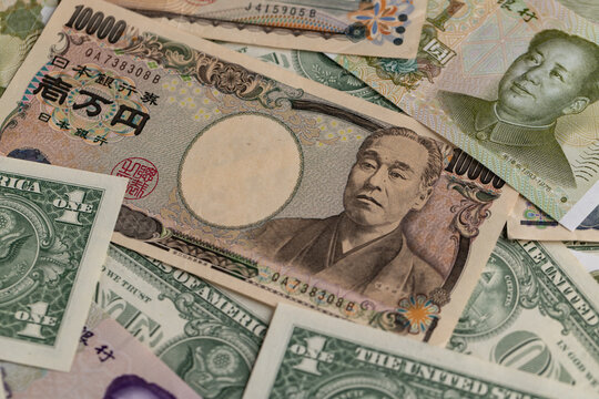 Multicurrency Collage Featuring Japanese Yen, US Dollars, and Chinese Yuan